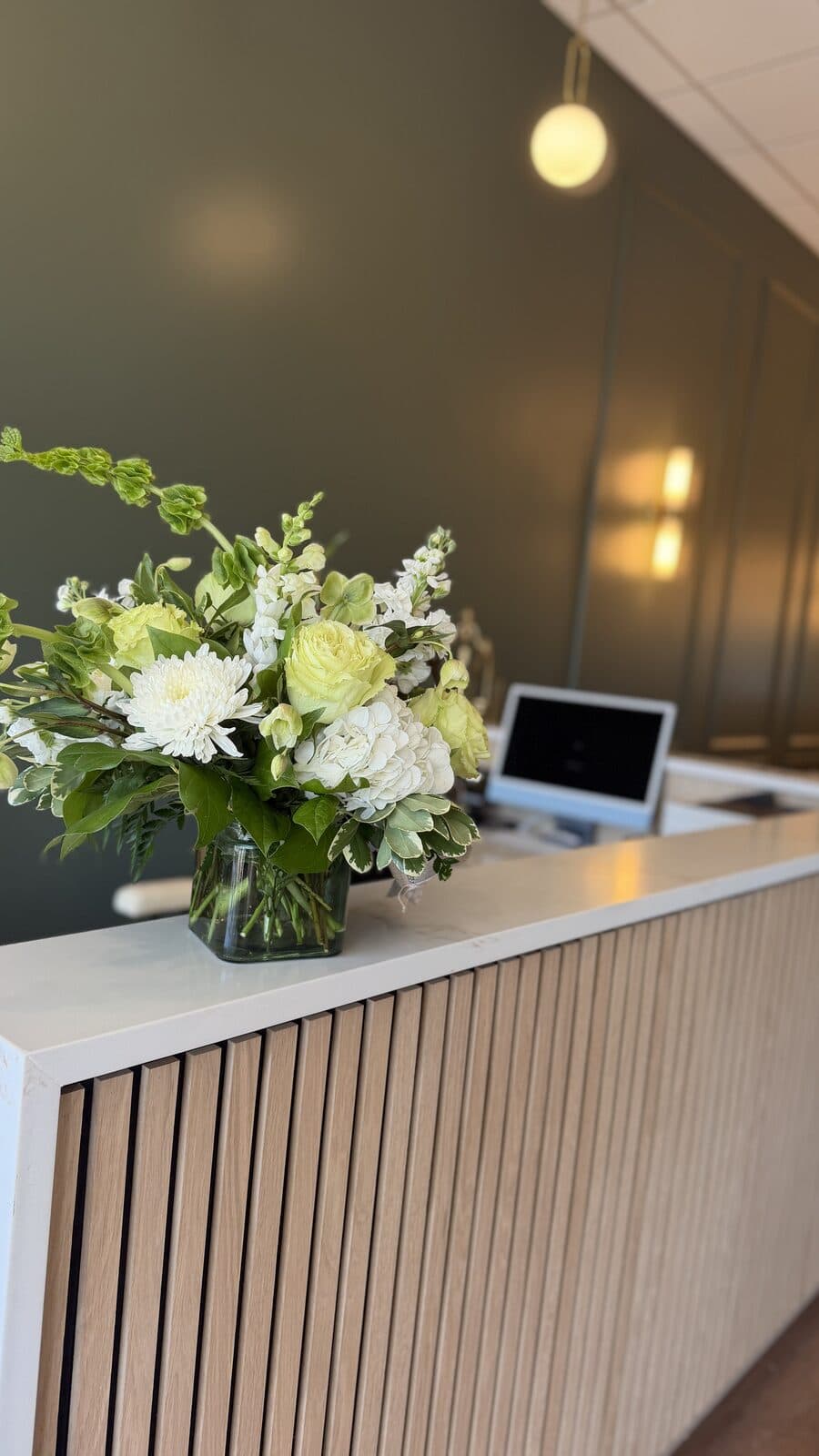 Fresh flowers at the Collective Wellness front desk