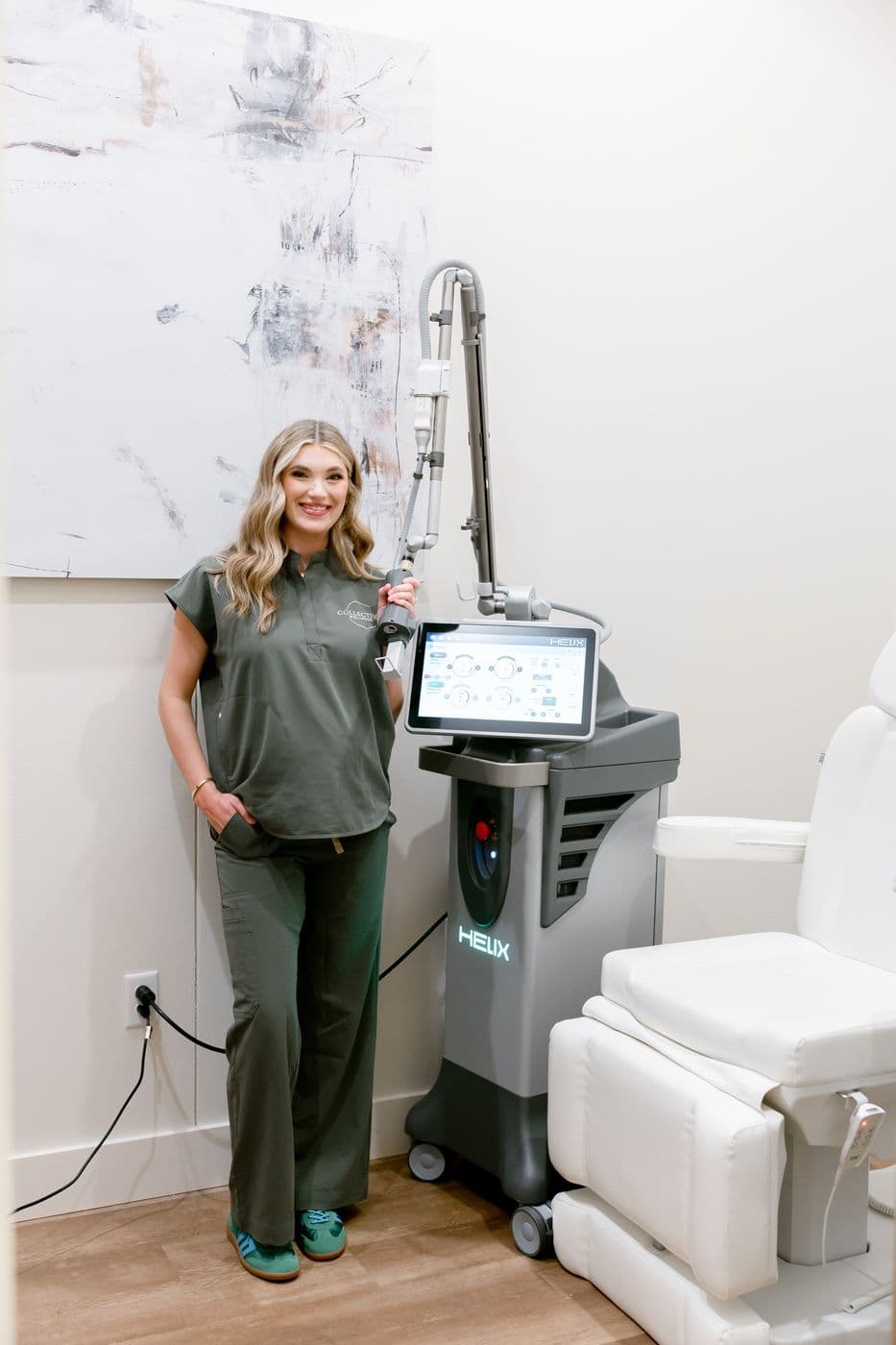 Our medical esthetician beside the Helix laser